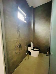 a bathroom with a shower with a toilet in it at Happy Villa in Phú Hiệp +7 photos