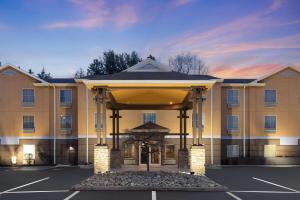 a hotel with a gazebo in a parking lot at Super 8 by Wyndham Mars/Cranberry/Pittsburgh Area in Cranberry Township