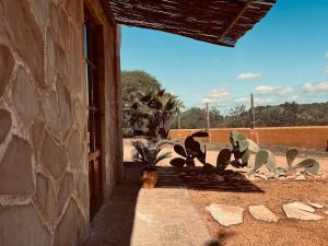 a group of statues of birds sitting outside of a building at Balearic Sunset Apartment in Santa Gertrudis de Fruitera
