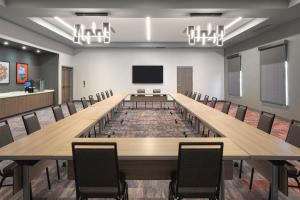 a large conference room with a long table and chairs at Tru By Hilton Spring Hill in Spring Hill +45 photos