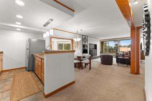 an open kitchen and living room with a dining room at Pines #2124 in Keystone