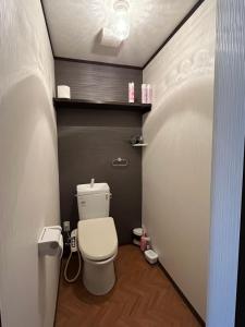 a bathroom with a toilet in a small room at 民泊 シェアハウス北浦 in Senboku +26 photos