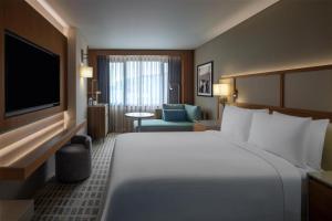 a hotel room with a large bed and a television at Doubletree By Hilton Istanbul Macka in Istanbul +85 photos