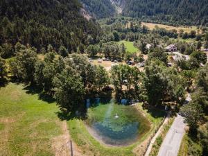 an aerial view of a lake in a field at Huttopia Val Cenis in Val Cenis +20 photos