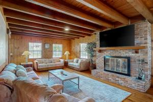 a living room with a couch and a fireplace at 3424 Indian River Dr Main in Cocoa