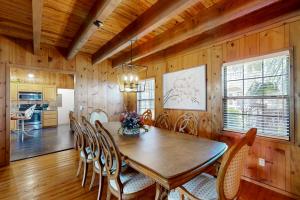 a dining room with a wooden table and chairs at 3424 Indian River Dr Main in Cocoa