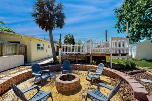a group of chairs sitting around a fire pit at 2403 Auburn Dr in Cocoa +24 photos