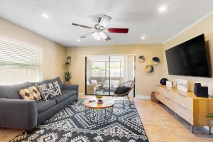 a living room with a couch and a flat screen tv at 2403 Auburn Dr in Cocoa