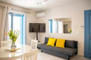 a living room with a couch and a table at Casa Mary Aegina in Egina