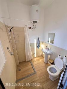 a bathroom with a toilet and a sink at The Galley Party Hostel in Shkodër +41 photos