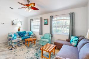 a living room with a couch and chairs and a ceiling fan at 1295 Barber St in Sebastian