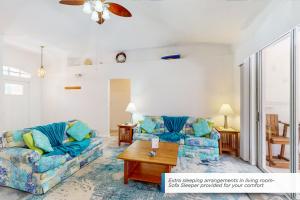 a living room with two couches and a coffee table at 1295 Barber St in Sebastian