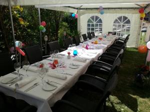 a long long table with chairs and wine glasses at Hotel Alex Business & SPA in Naters +93 photos