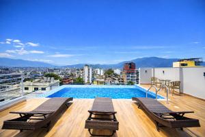 a swimming pool on the roof of a building at Divine Kathmandu Hotel in Kathmandu