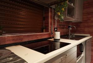 a kitchen with a sink and a counter top at The Ngatchou in Mestre +64 photos