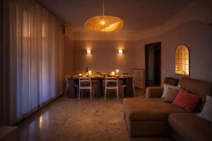 a living room with a table and a couch at Villa 70 in Peschiera del Garda