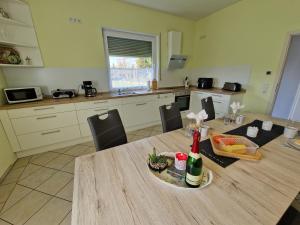 a kitchen with a table with a plate of food on it at Ferienhaus Ruth in Walow