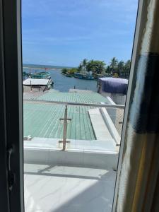 a view from a window of a church with a cross at Beachside home 2 in Phú Quốc