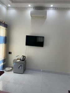 a room with a wall with a flat screen tv at Beachside home 2 in Phú Quốc