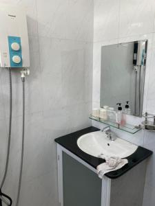 a bathroom with a sink and a mirror at Beachside home 2 in Phú Quốc