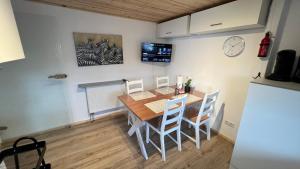 a kitchen and dining room with a table and chairs at D1 - Klein aber fein in Wernigerode