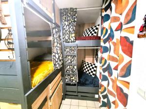 a room with two bunk beds in a room at Le TERMINUS in Saint-Cyprien-Plage +17 photos