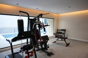 a room with a gym with several exercise bikes at Royal Palace Hotel - Al Olaya in Riyadh