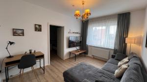 a living room with a couch and a table at A2 - Viel Platz für alle in Wernigerode
