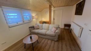 a living room with a couch and a table at D1 - Klein aber fein in Wernigerode