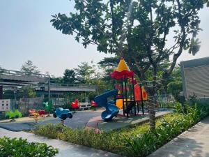 a playground with a slide in a park at Saigon Getaway Apartment Thu Duc in Ho Chi Minh City