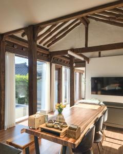 a dining room with a wooden table and chairs at 안동 108한옥 in Andong