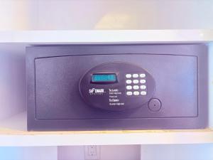 a microwave oven sitting on top of a shelf at Condohotel The Carmen Deluxe Oceanview King Suite in Playa del Carmen +47 photos
