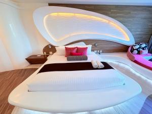 a bedroom with a bed and a bath tub at Condohotel The Carmen Deluxe Oceanview King Suite in Playa del Carmen