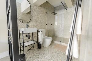 a bathroom with a toilet and a shower at inn here in Johannesburg