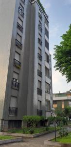 a tall building with balconies on the side of it at Casa Pirandello 3 min Metro in Sesto San Giovanni