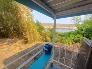 a view of a river from a porch at S&A Camping in Ban Kum