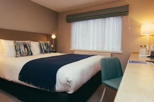 A bed or beds in a room at Peter Scott House Birmingham 