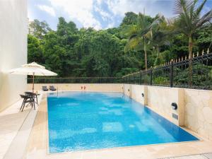a swimming pool in the middle of a house at Inn Hotel Macau in Macau