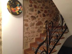 a set of stairs with a stone wall at Hostal Aranda in Peniscola