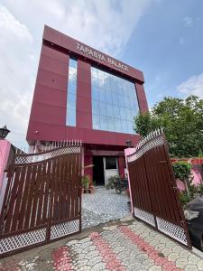 a building with a gate in front of it at Tapasya Palace in Gorakhpur +30 photos