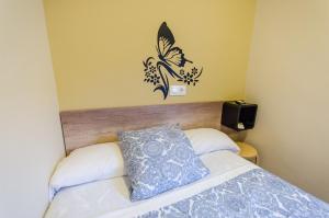 Posteľ alebo postele v izbe v ubytovaní Hostal La Pastora