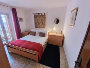 a bedroom with a large bed and a window at Casa di Marie in Mafalda +5 photos