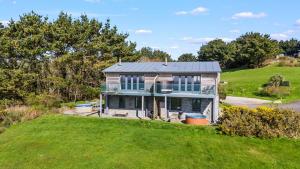 an aerial view of a house on a hill at House 43 in Looe