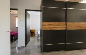 a room with a sliding glass door with a bedroom at Villa Paola Vinez in Labin +14 photos