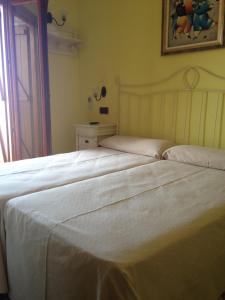 Postel nebo postele na pokoji v ubytování Hostal Aranda