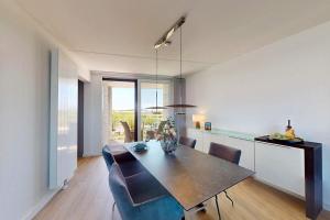 a dining room with a table and chairs at Port Scaldis 05-012 in Breskens