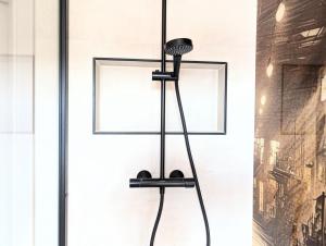 a black microphone stand in front of a window at II Bramasole - La Contessa in Spreewitz