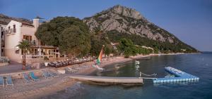 a body of water with a mountain in the background at Boutique Hotel Marco Polo in Gradac