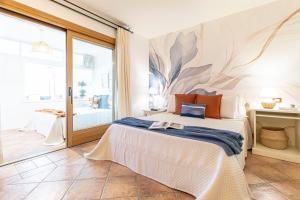 a bedroom with a bed with a mural on the wall at Smeralda 15 in Porto Rotondo