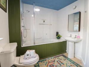 a bathroom with a toilet and a sink and a shower at 32 Crescent Street in Newtown +19 photos